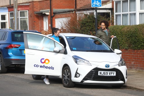 Co Wheels car being used by two people in a street